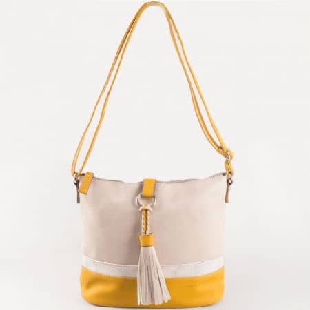 Дамска ежедневна чанта с пискюл и практично разпределение на френския производител David Jones в бежов и жълт цвят ch5080-1j